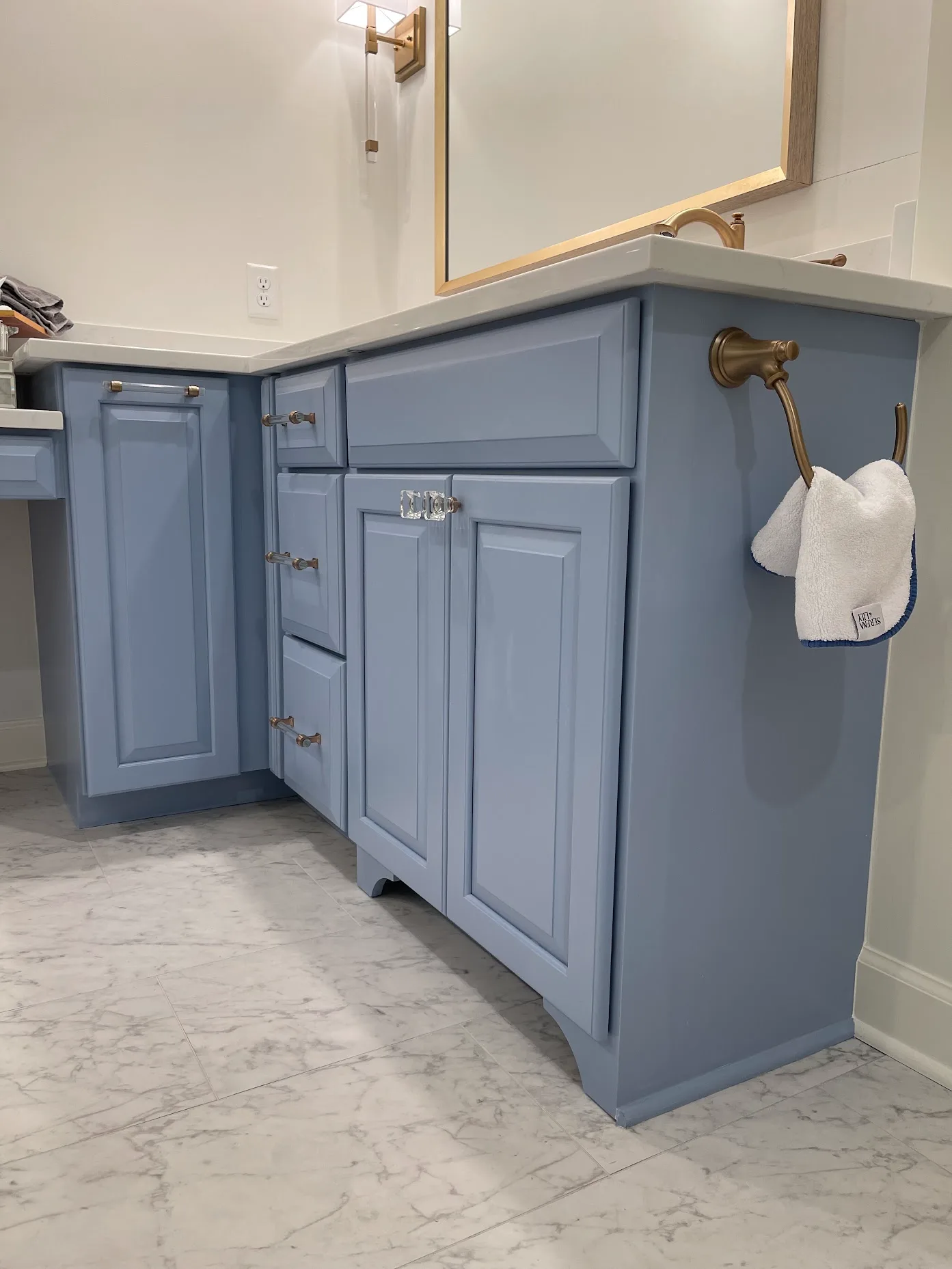 Bathroom vanity sprayed a soft blue with brass hardware in Nashville TN