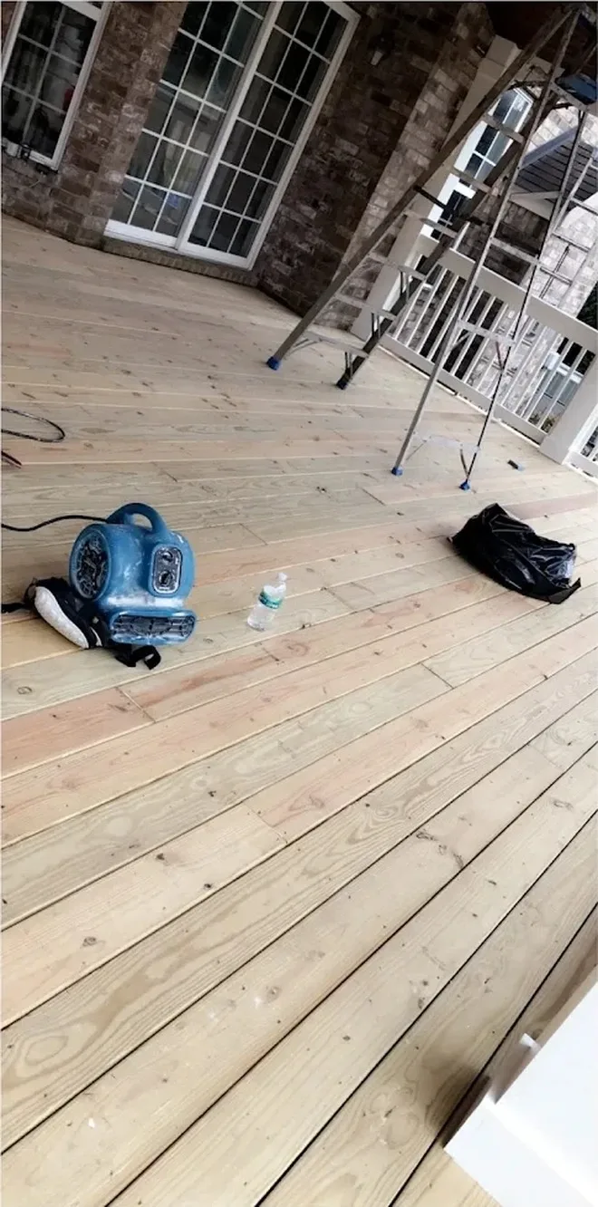 Bare deck boards washed and prepped before staining