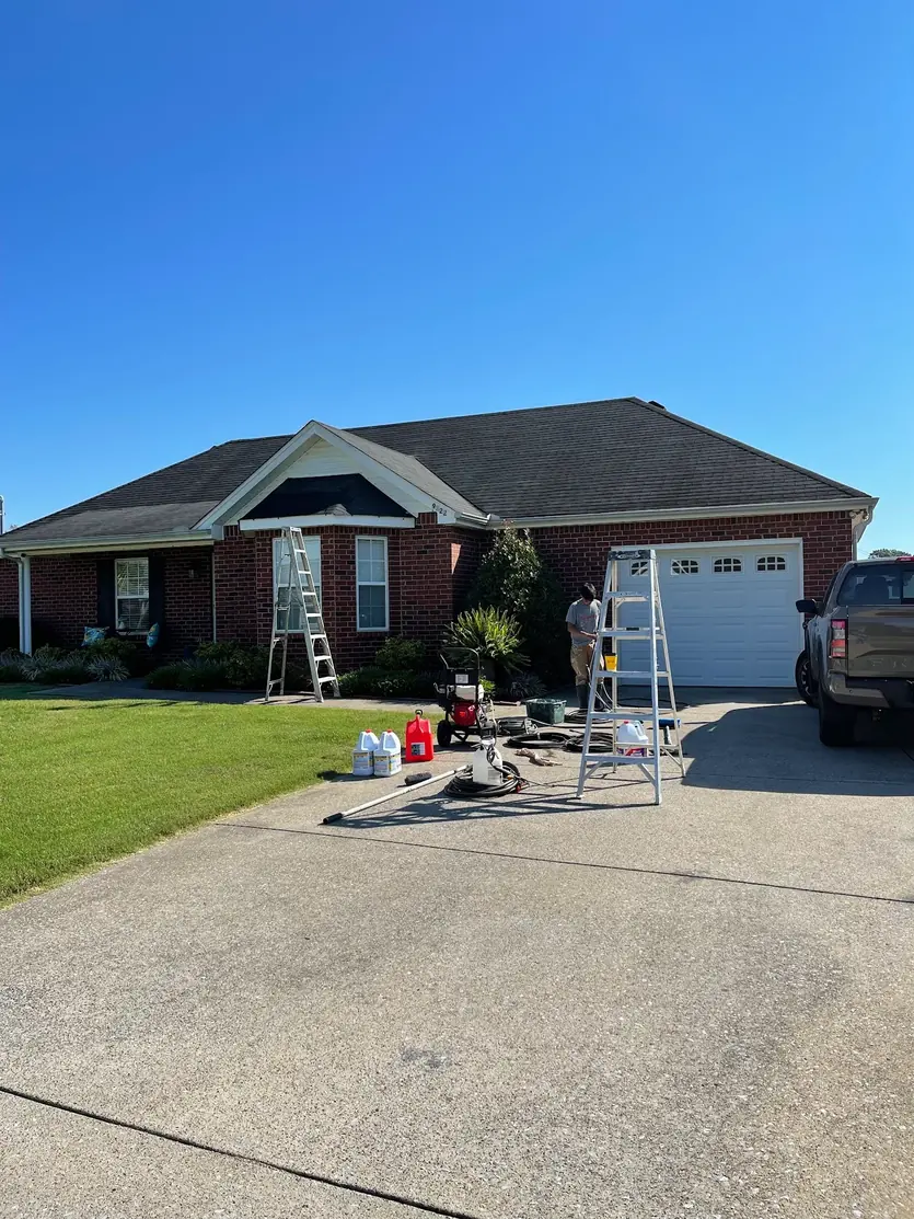 Towers Painting Solutions crew washing and prepping a brick exterior in Middle Tennessee