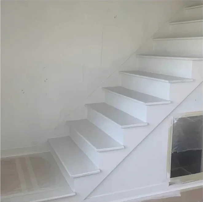 Stair stringers and spindles painted white in Antioch TN