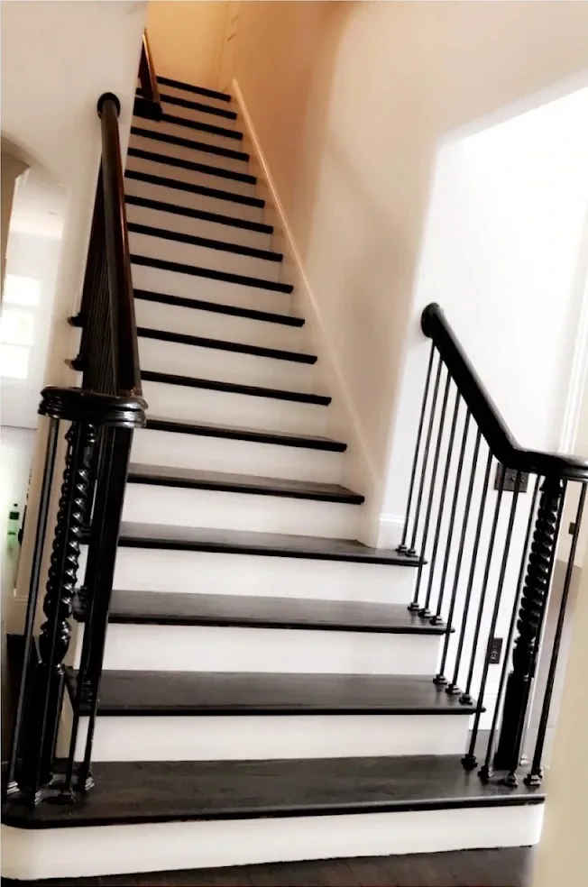 Staircase risers painted white with refinished treads in a Nashville home