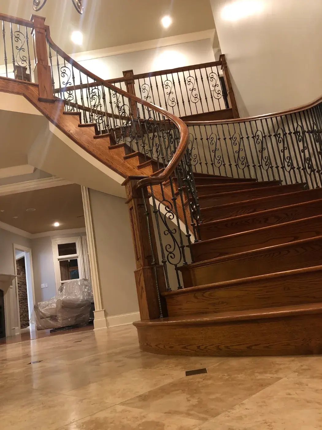 Refinished oak staircase and iron balusters in a Nashville home